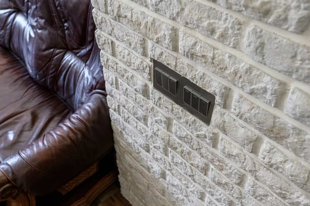 Dark switch plate assemblies